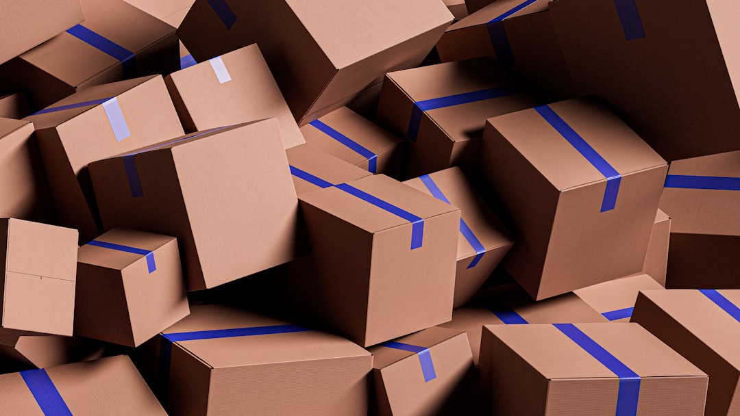 services-04 a-large-pile-of-brown-cardboard-boxes-with-blue-tape-qo2ztaz5g7a